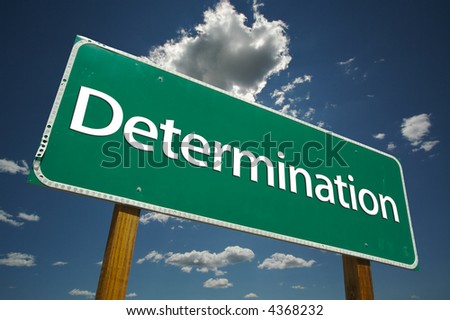 "Determination" Road Sign with dramatic clouds and sky.