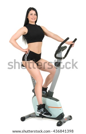 young woman posing on indoor bike
