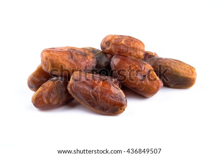 Kurma or dried dates fruit on white background. Dates are popular as food supplement during Ramadan among Muslims. Royalty-Free Stock Photo #436849507