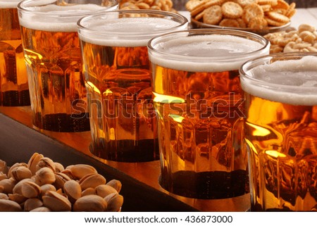 Football fan set with beer and snacks on wooden background