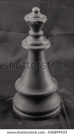 chess piece, black plaster on a black background
