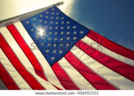 Closeup USA,American flag,the symbolic of liberty,freedom,patriotic,honor,american family,kids,nation,independence day,4th of July,labor day,waving by the wind blow.