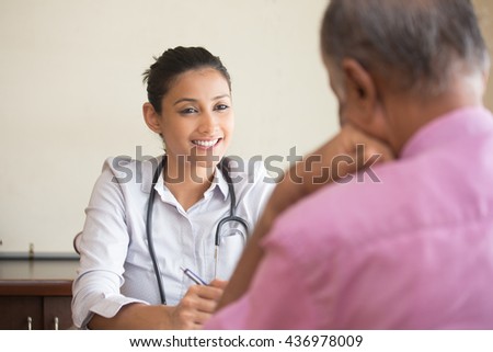 Closeup portrait, patient talking good news conversation to healthcare professional, isolated indoors background Royalty-Free Stock Photo #436978009