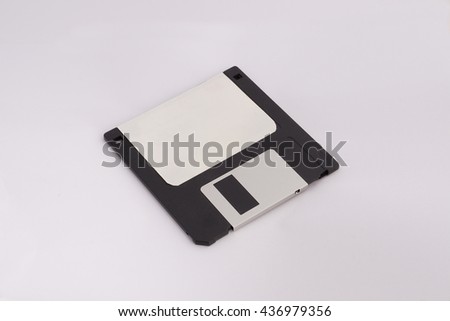 Floppy disk (black) with white label on white background.