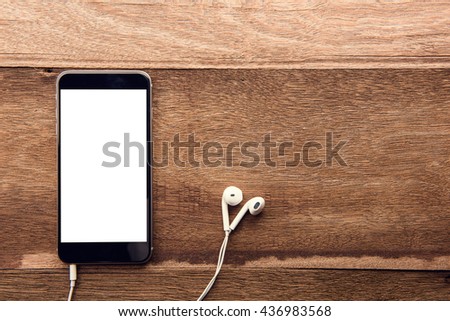 Smartphone with white screen On Wooden Table With Copyspace