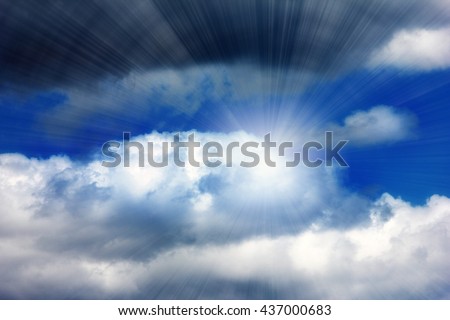 dark stormy sky with clouds and bright sunlight