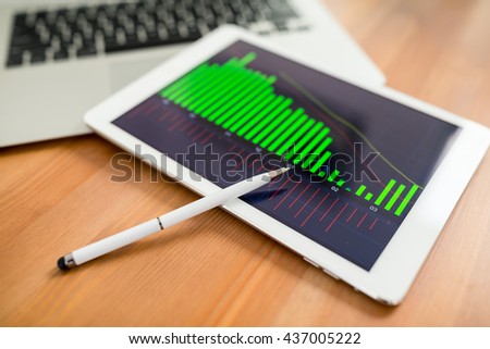 Modern digital tablet with business media website on a screen 