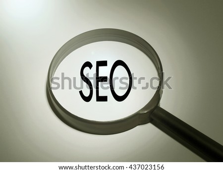 Magnifying glass with the word seo. Searching seo