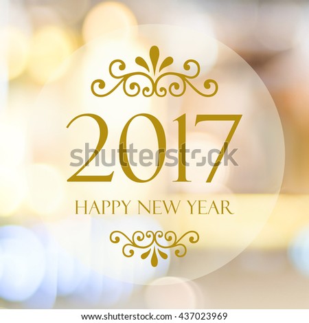 Happy New Year 2017 year on abstract blur festive bokeh background Royalty-Free Stock Photo #437023969