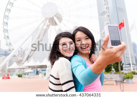 Friends taking self image together