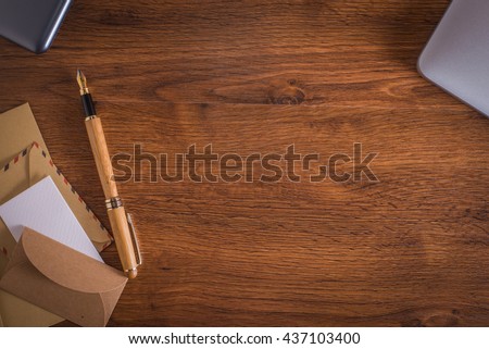 Wood table with pen and notebook