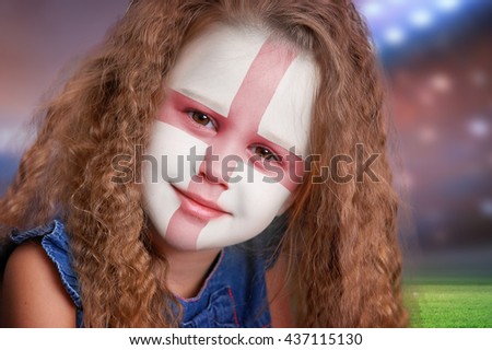 Soccer fan little girl portrait with flag of England on face