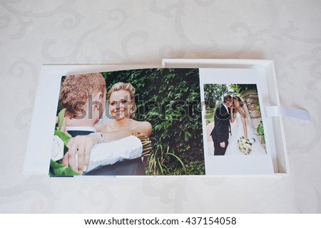 Dual pages of wedding photo book with wedding couple