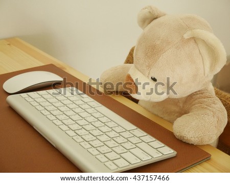 Teddy Bear toy with computer keyboard
