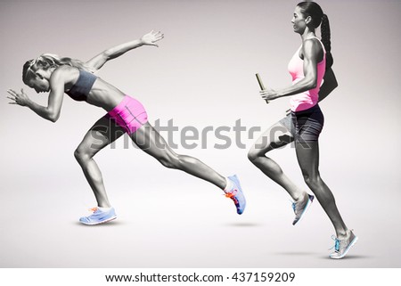 Sporty woman running on a grey background