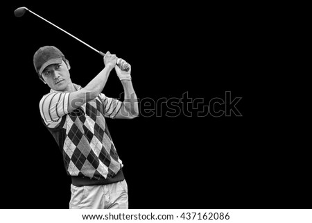 Man playing golf against black background