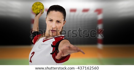 Sportswoman throwing a ball against digital image of handball goal
