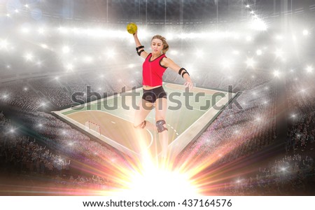 Female athlete with elbow pad throwing handball against handball field indoor