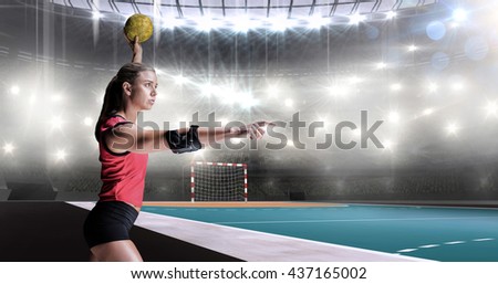 Female athlete with elbow pad throwing handball against handball field indoor