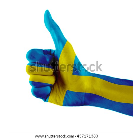 Sweden flag painted hand showing thumbs up sign on isolated white background with clipping path
