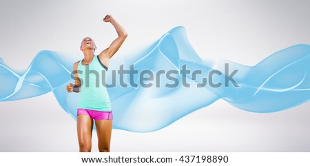 Sportswoman celebrating her victory against blue wave