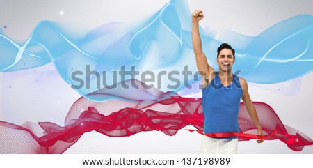 Portrait of cheerful winner athlete crossing finish line against blue wave