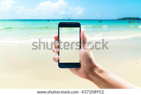 hands of man taking the photo to smartphone