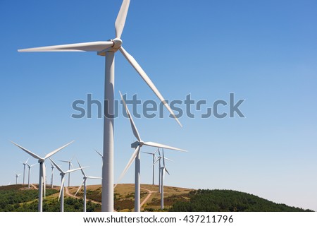 Windmills for electric power production, Burgos Province, Castilla Leon, Spain. Royalty-Free Stock Photo #437211796