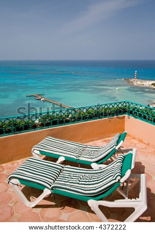 Resort hotel balcony with chaise longues in cancun mexico in the tropics