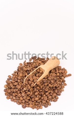 Pile of coffee beans over white background
