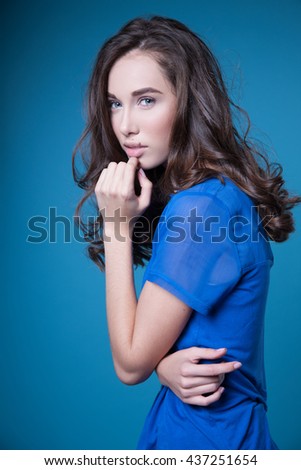 Young woman in stylish clothing, studio picture