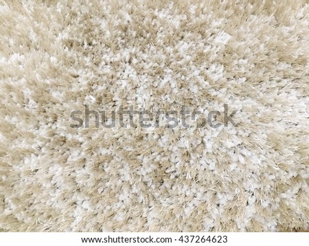 Background picture of a brown and white carpet