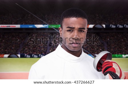 Portrait of swordsman holding sword against composite image of tennis ground with supporters