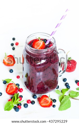 Smoothie. Berry mix smoothie in a mason jar on white background. Healthy drink.