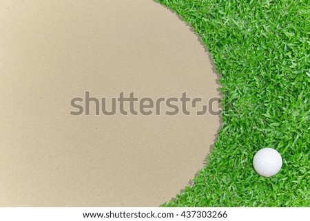 Golf ball on the golf course with sand trap