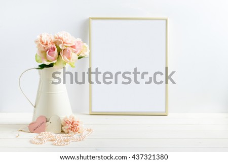 Mockup styled stock photograph of cream jug of flowers next to a Gold frame. You can place your business promotion, blog title, quote, headline or image in the frame.