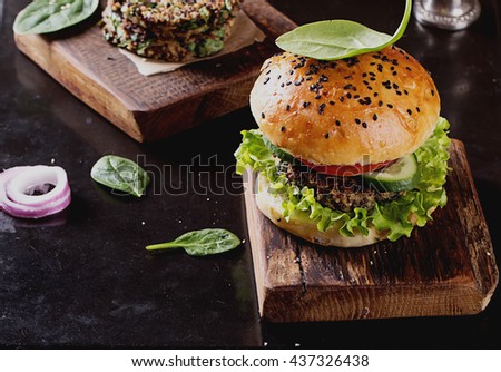 Veggie quinoa burgers with  lettuce, tomato and spinach