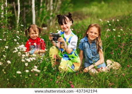 Children pictures of flowers on the meadow.