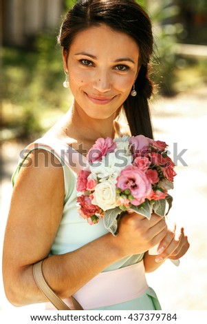 The bridesmaid with bouquet