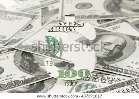 Dollar sign carved out of money