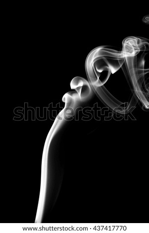 Abstract white on black background from the incense sticks