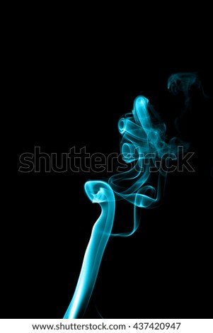 Abstract cyan smoke on black background from the incense sticks