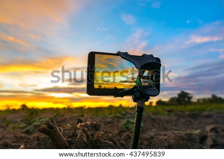 mobile phone shooting photo and time-lapse Beautiful color sunset sky