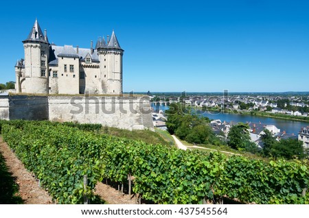 Saumur castle and Loire River, Loire Valley, France. Saumur Castle was built in the tenth century and rebuilt in the late twelfth century. Royalty-Free Stock Photo #437545564