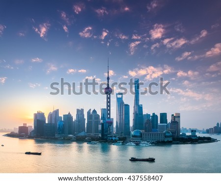 shanghai skyline in sunrise , the rosy colour of dawn spreads all over the sky.