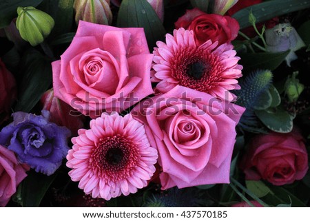 Gerberas and roses in a wedding flower arrangement