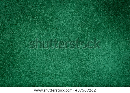Green texture background with bright center spotlight