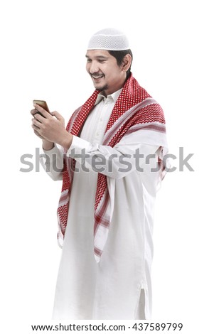 Portrait of muslim man using cellphone isolated over white background