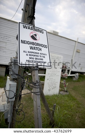 Warning sign in yard after Hurricane Katrina, New Orleans, Louisiana
