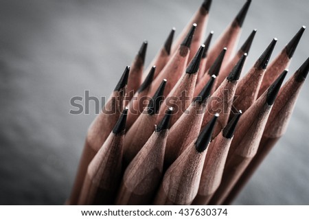 Sharp pencils on black background.